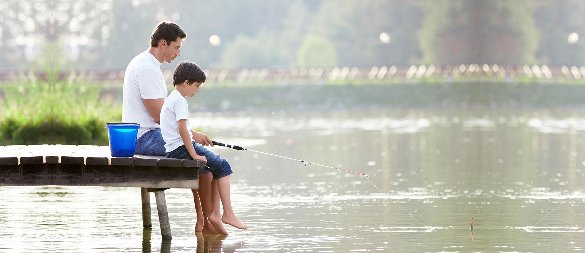 Father and Son Fishing at a Dock